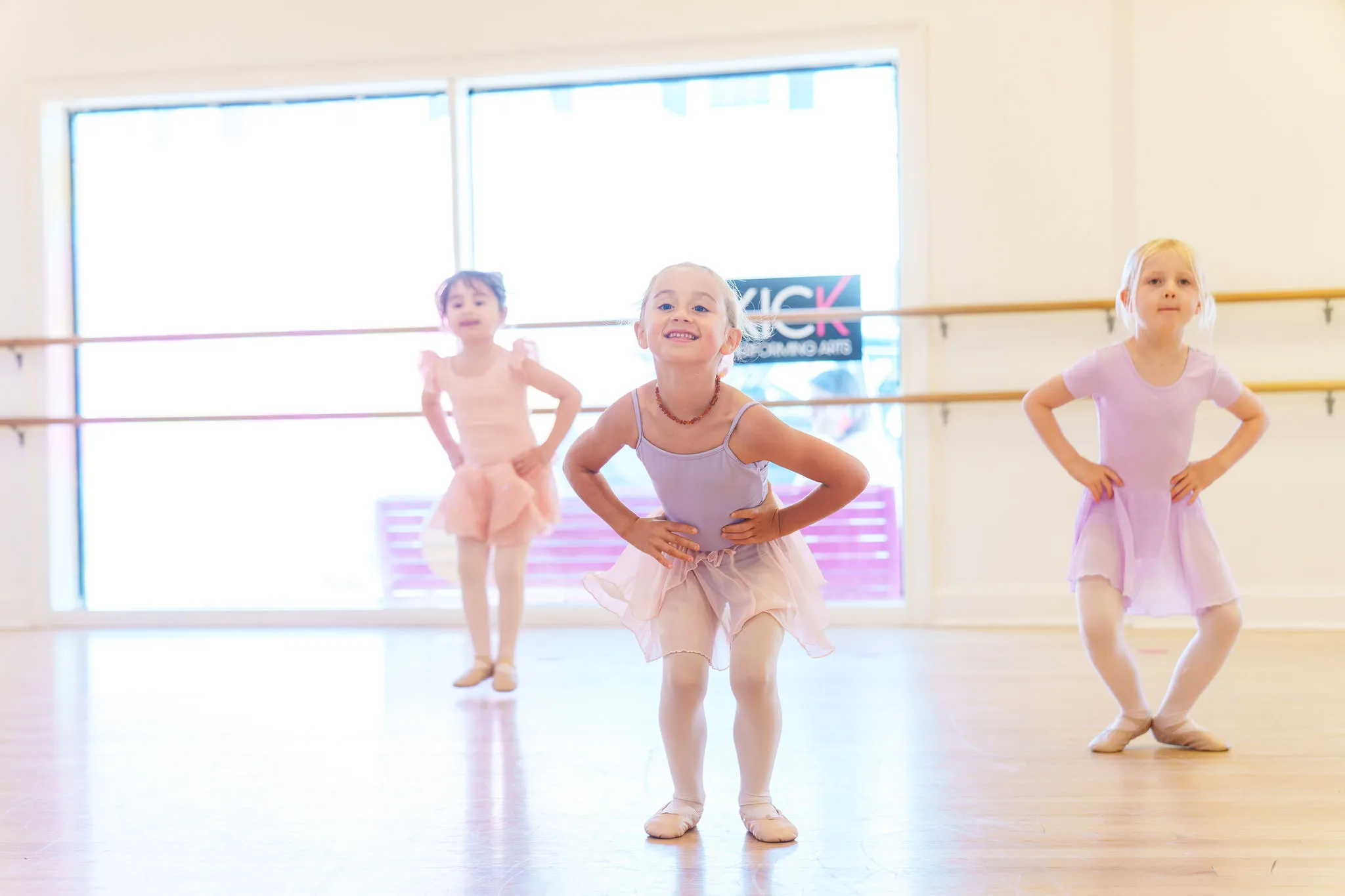 Young ballet students in pink leotards during class at KICK Fair Haven